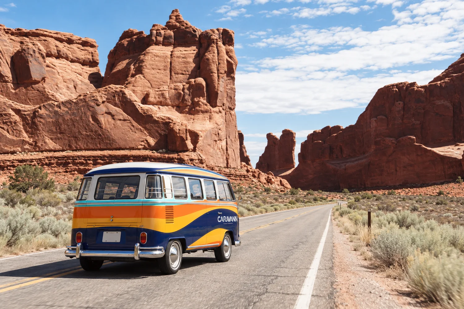 The Caravann bus driving an open road through red rock country
