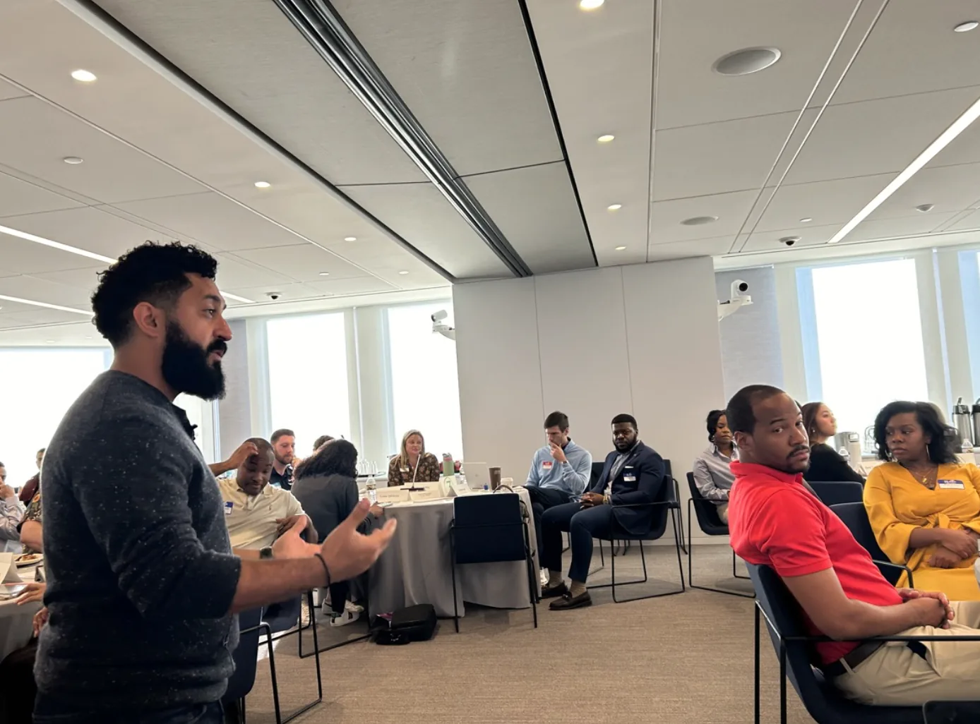 A working session with LEAD Atlanta leaders seated around tables